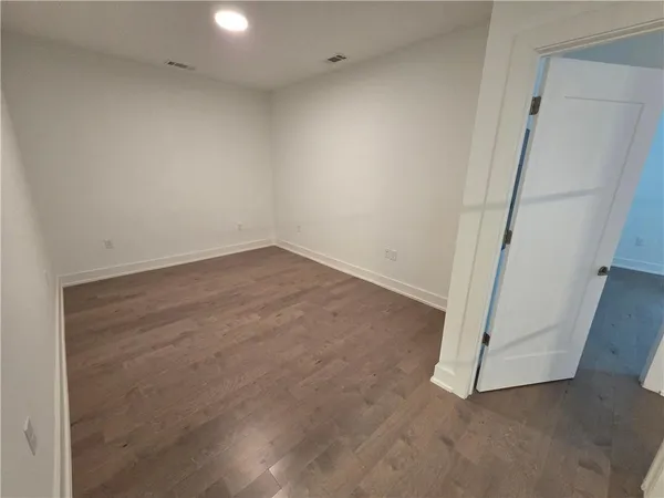 a bathroom with a double vanity sink toilet and mirror