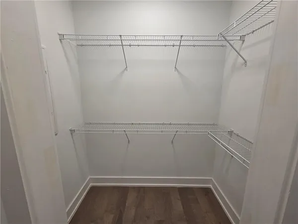 a bathroom with a shower sink and mirror