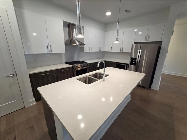 a stove top oven sitting inside of a kitchen