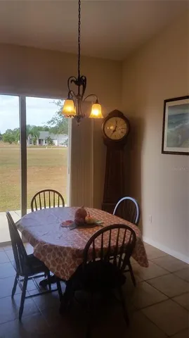 a view of a dining table and chairs in the balcony