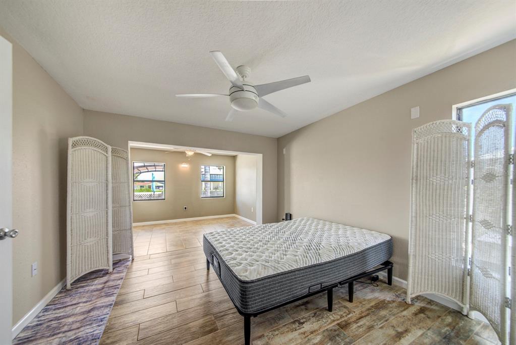 4266 Deleon Drive Hernando Beach, FL 34607 - Photo 20 of 65 a living room with furniture and window