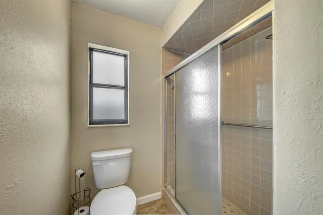 a view of a bathroom from a hallway
