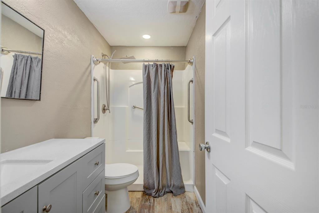 4266 Deleon Drive Hernando Beach, FL 34607 - Photo 29 of 65 a bathroom with a shower toilet and sink
