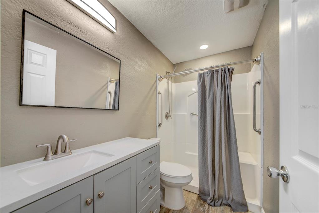4266 Deleon Drive Hernando Beach, FL 34607 - Photo 30 of 65 a bathroom with a sink toilet and shower