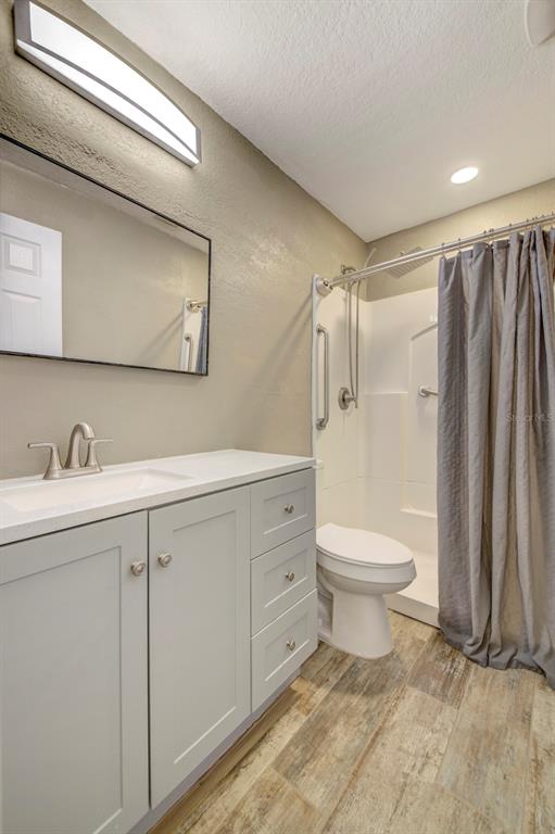 4266 Deleon Drive Hernando Beach, FL 34607 - Photo 31 of 65 a bathroom with a toilet sink and a shower