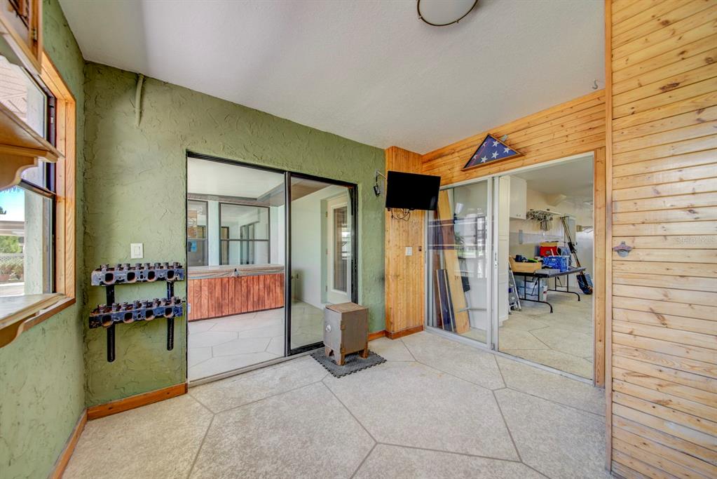 4266 Deleon Drive Hernando Beach, FL 34607 - Photo 47 of 65 a view of a porch with furniture and next to a window
