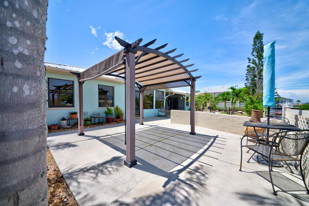 4266 Deleon Drive Hernando Beach, FL 34607 - Photo 49 of 65 a view of a house with sitting area and furniture