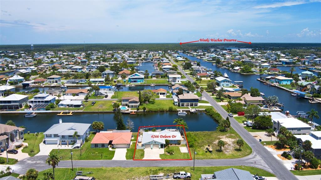 4266 Deleon Drive Hernando Beach, FL 34607 - Photo 60 of 65 an aerial view of a house with a swimming pool fire pit and outdoor seating