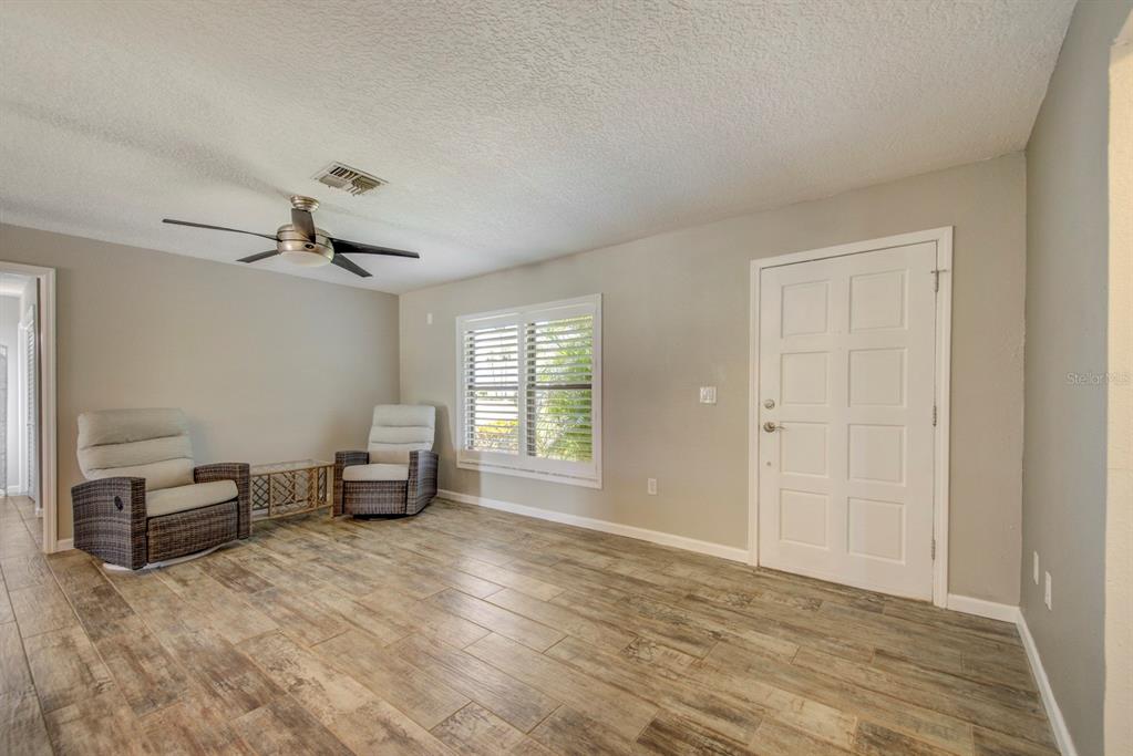 4266 Deleon Drive Hernando Beach, FL 34607 - Photo 7 of 65 a view of a livingroom with workspace and a window