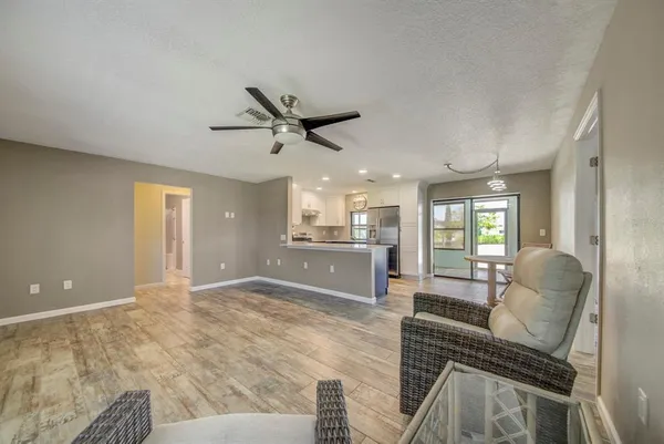 a living room with furniture and a large window