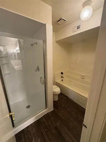a bathroom with a sink a mirror and a shower