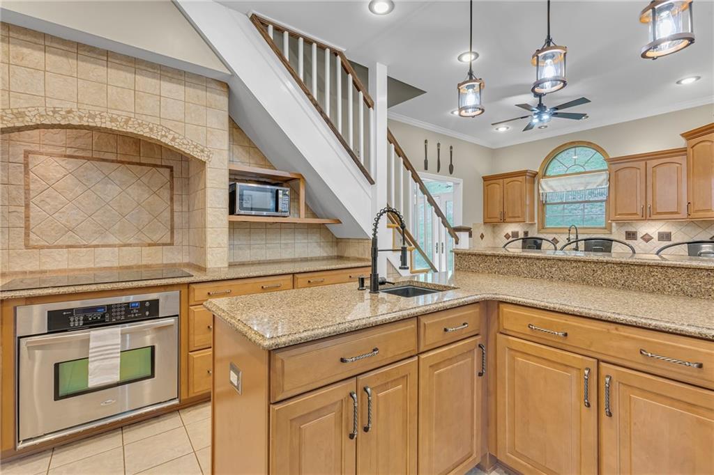 545 6th Avenue Freedom, PA 15042 - Photo 11 of 50 a kitchen with cabinets and chandelier