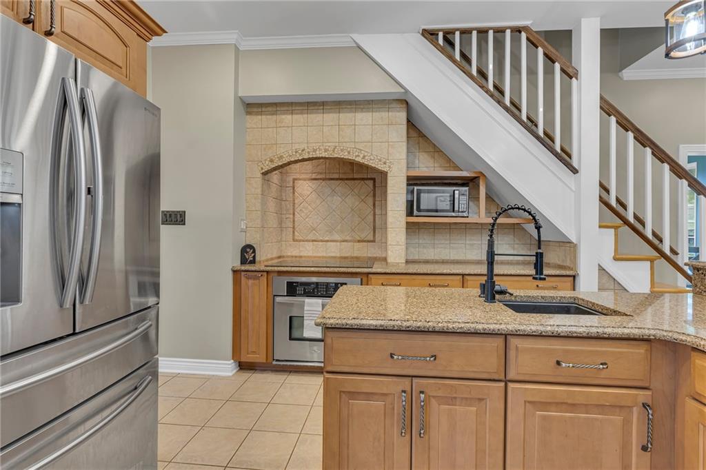 545 6th Avenue Freedom, PA 15042 - Photo 12 of 50 a bathroom with a granite countertop sink and a refrigerator