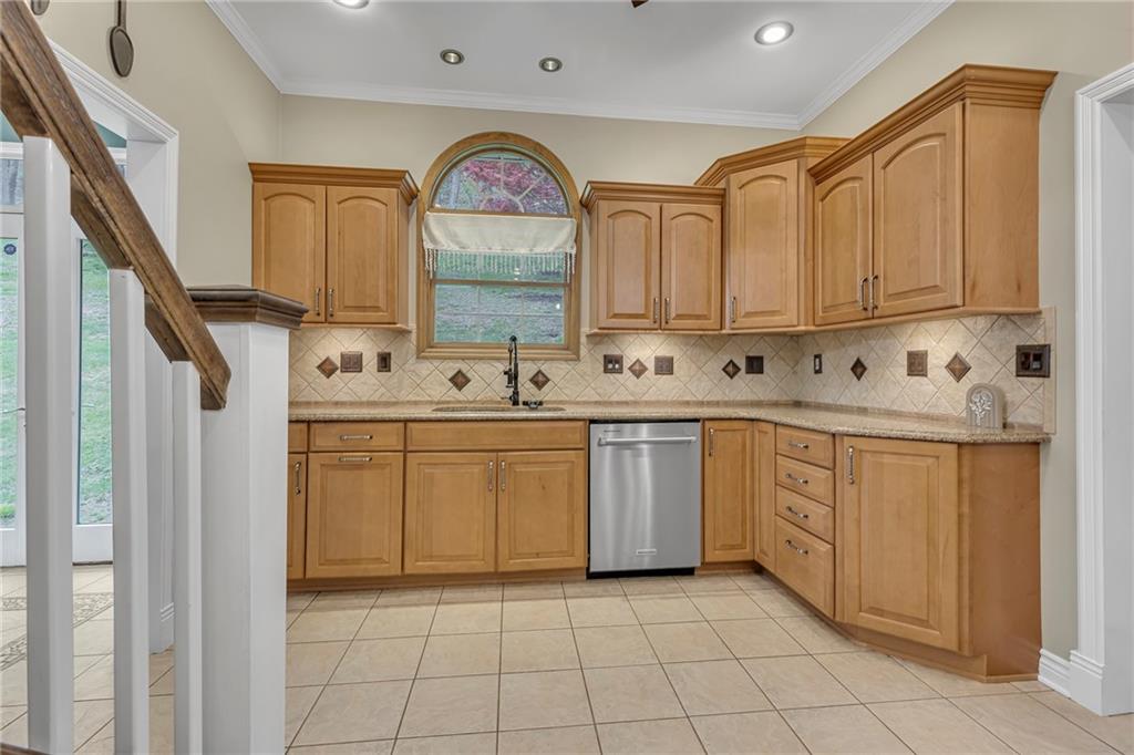 545 6th Avenue Freedom, PA 15042 - Photo 14 of 50 a kitchen with stainless steel appliances granite countertop a sink a stove and cabinets