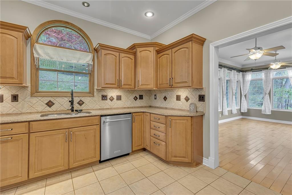 545 6th Avenue Freedom, PA 15042 - Photo 15 of 50 a kitchen with stainless steel appliances granite countertop a sink and cabinets