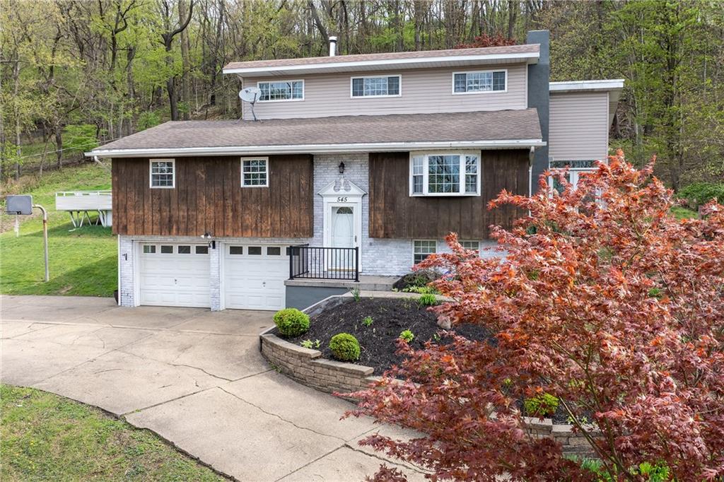 545 6th Avenue Freedom, PA 15042 - Photo 2 of 50 a front view of a house with a garden