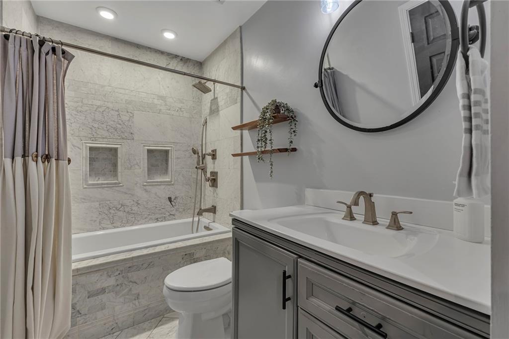 545 6th Avenue Freedom, PA 15042 - Photo 25 of 50 a bathroom with a sink a toilet and a mirror