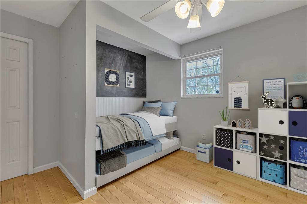 545 6th Avenue Freedom, PA 15042 - Photo 26 of 50 a bedroom with a bed and a chandelier