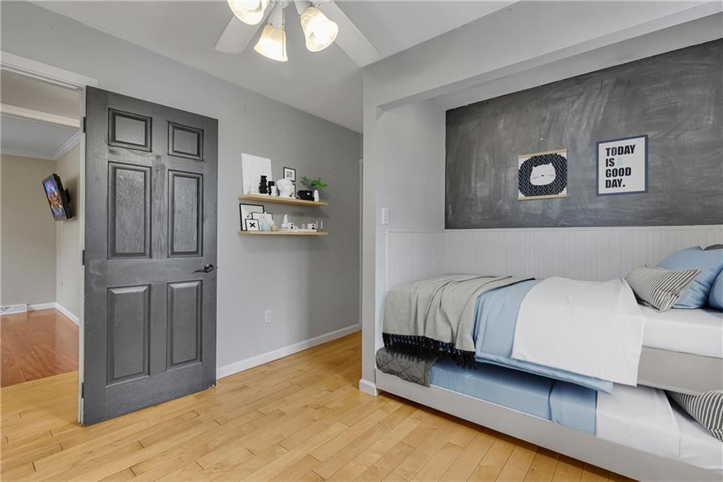 545 6th Avenue Freedom, PA 15042 - Photo 27 of 50 a bedroom with a bed and a painting on the wall