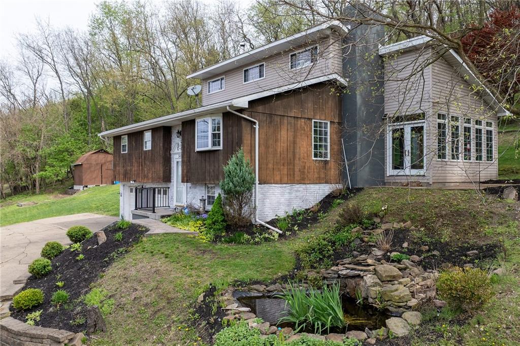 545 6th Avenue Freedom, PA 15042 - Photo 3 of 50 a front view of a house with garden