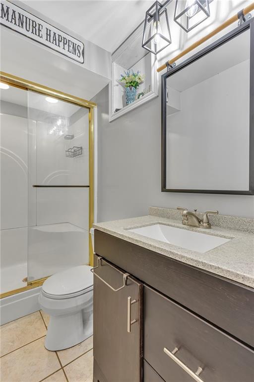 545 6th Avenue Freedom, PA 15042 - Photo 35 of 50 a bathroom with a granite countertop sink mirror vanity and toilet