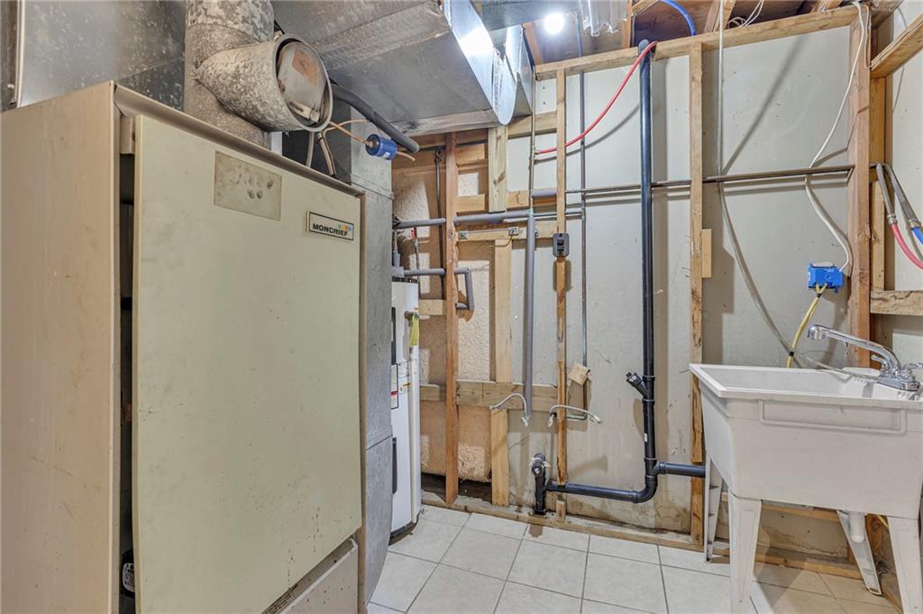545 6th Avenue Freedom, PA 15042 - Photo 36 of 50 a view of a storage & utility room with racks on the wall