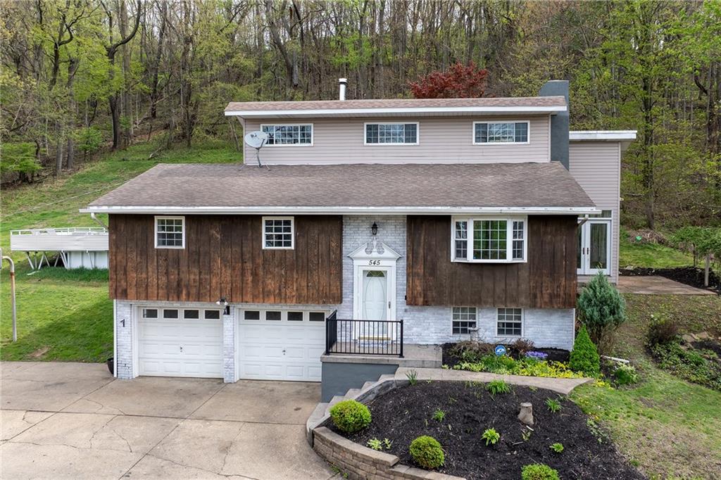 545 6th Avenue Freedom, PA 15042 - Photo 48 of 50 a front view of a house with a garden and yard