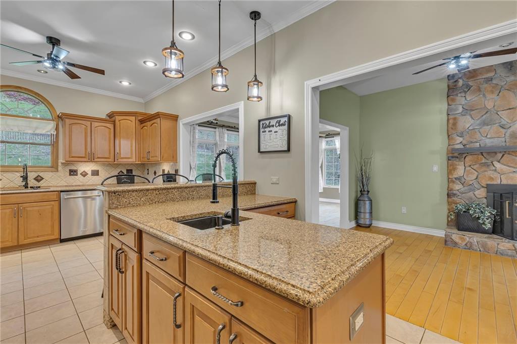 545 6th Avenue Freedom, PA 15042 - Photo 9 of 50 a kitchen with kitchen island granite countertop a sink appliances and cabinets