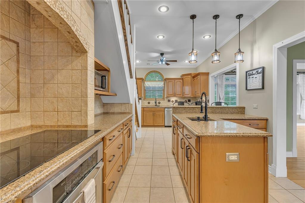 545 6th Avenue Freedom, PA 15042 - Photo 10 of 50 a large kitchen with stainless steel appliances granite countertop a sink and cabinets