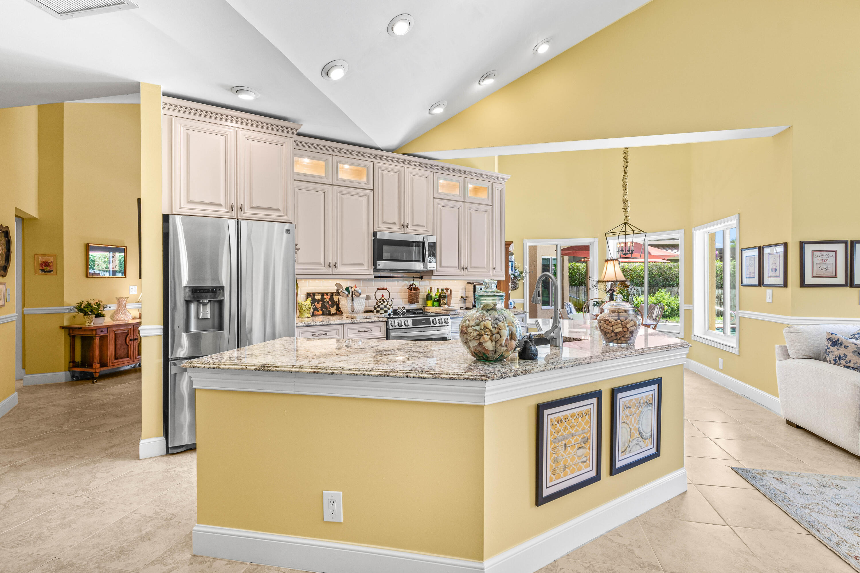 5986 Vista Linda Lane Boca Raton, FL 33433 - Photo 2 of 31 a kitchen with stainless steel appliances granite countertop a sink stove and refrigerator