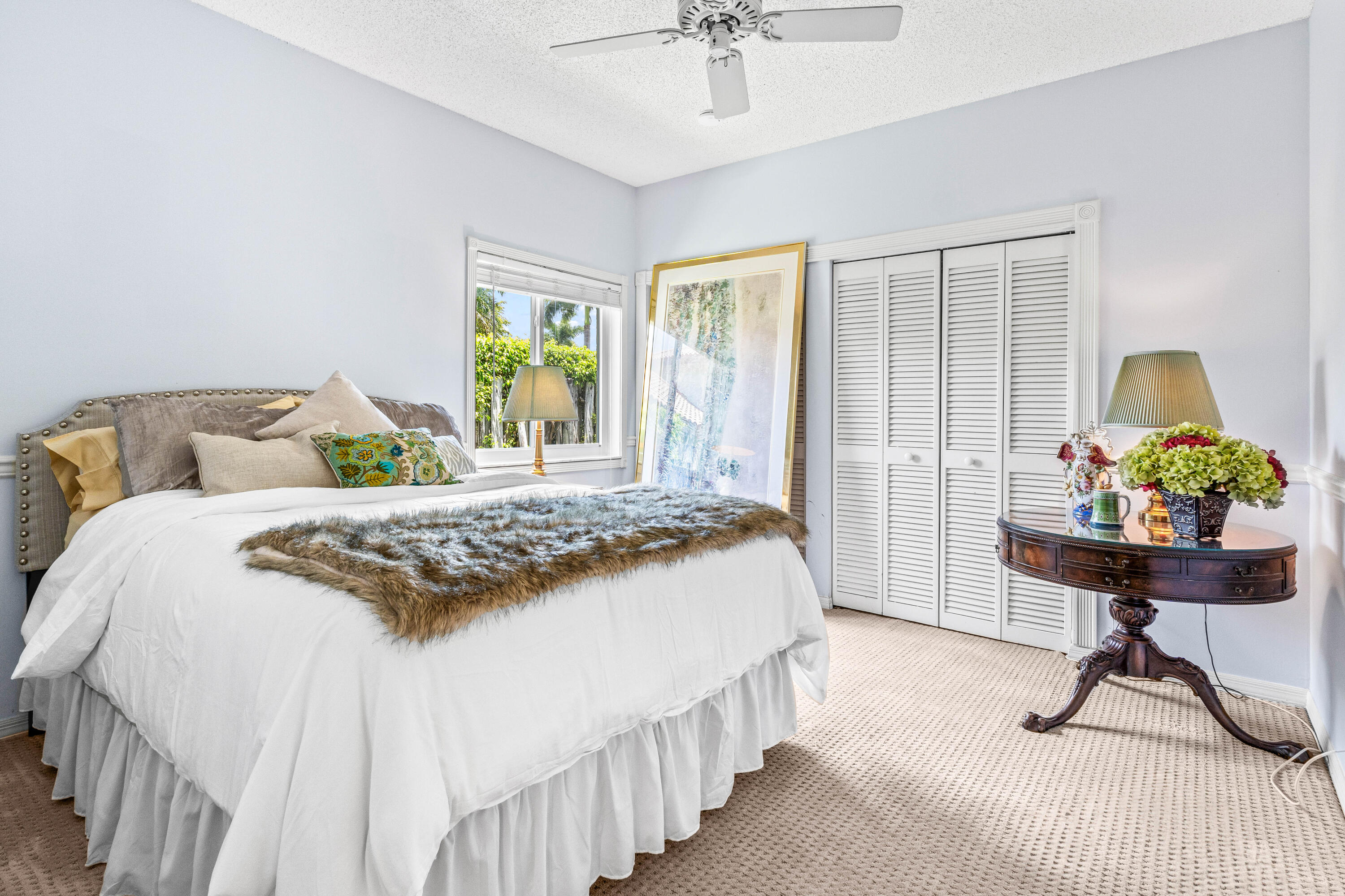 5986 Vista Linda Lane Boca Raton, FL 33433 - Photo 21 of 31 a bedroom with a bed and a table