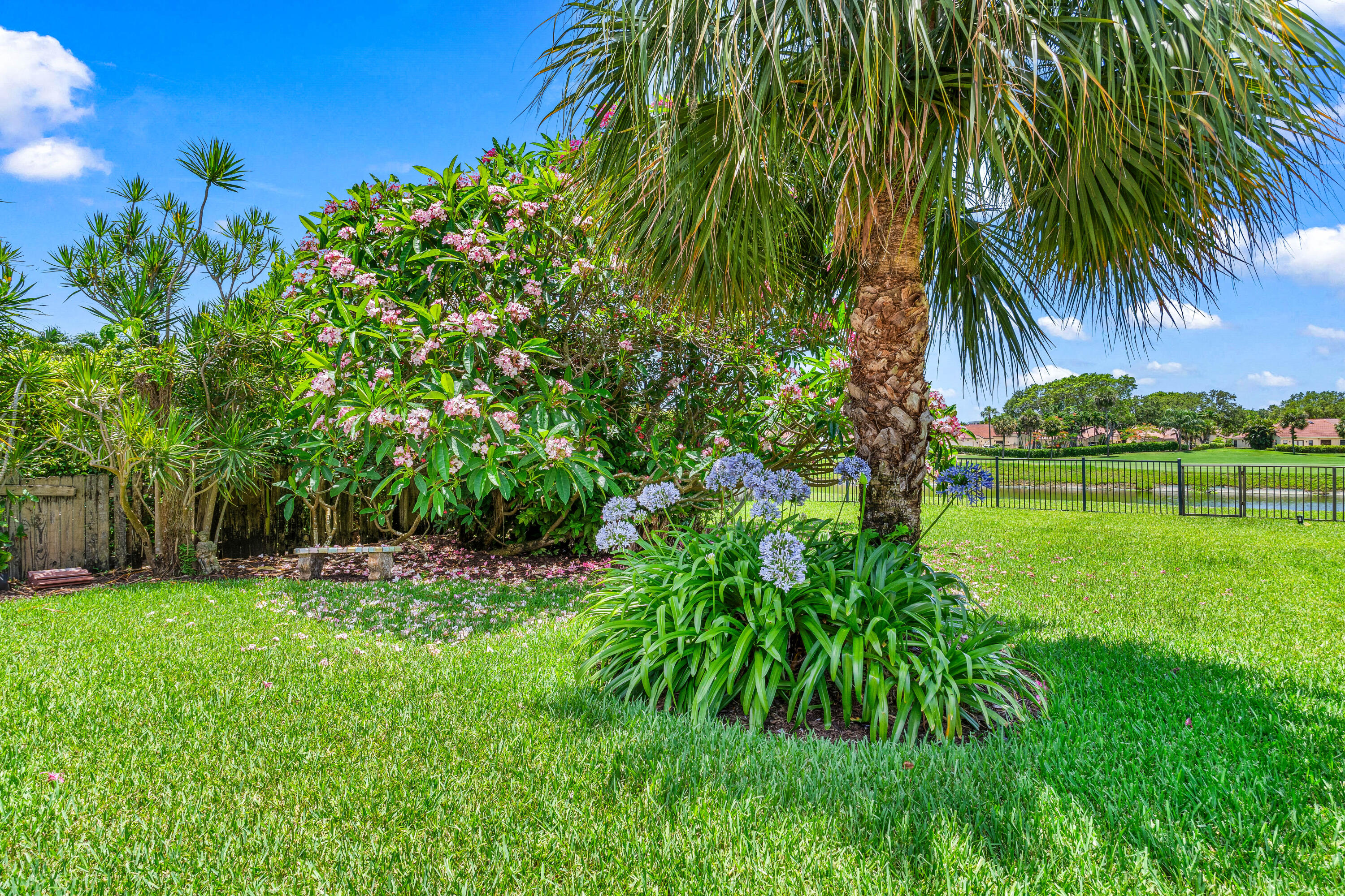 5986 Vista Linda Lane Boca Raton, FL 33433 - Photo 27 of 31 a garden with trees in front of it