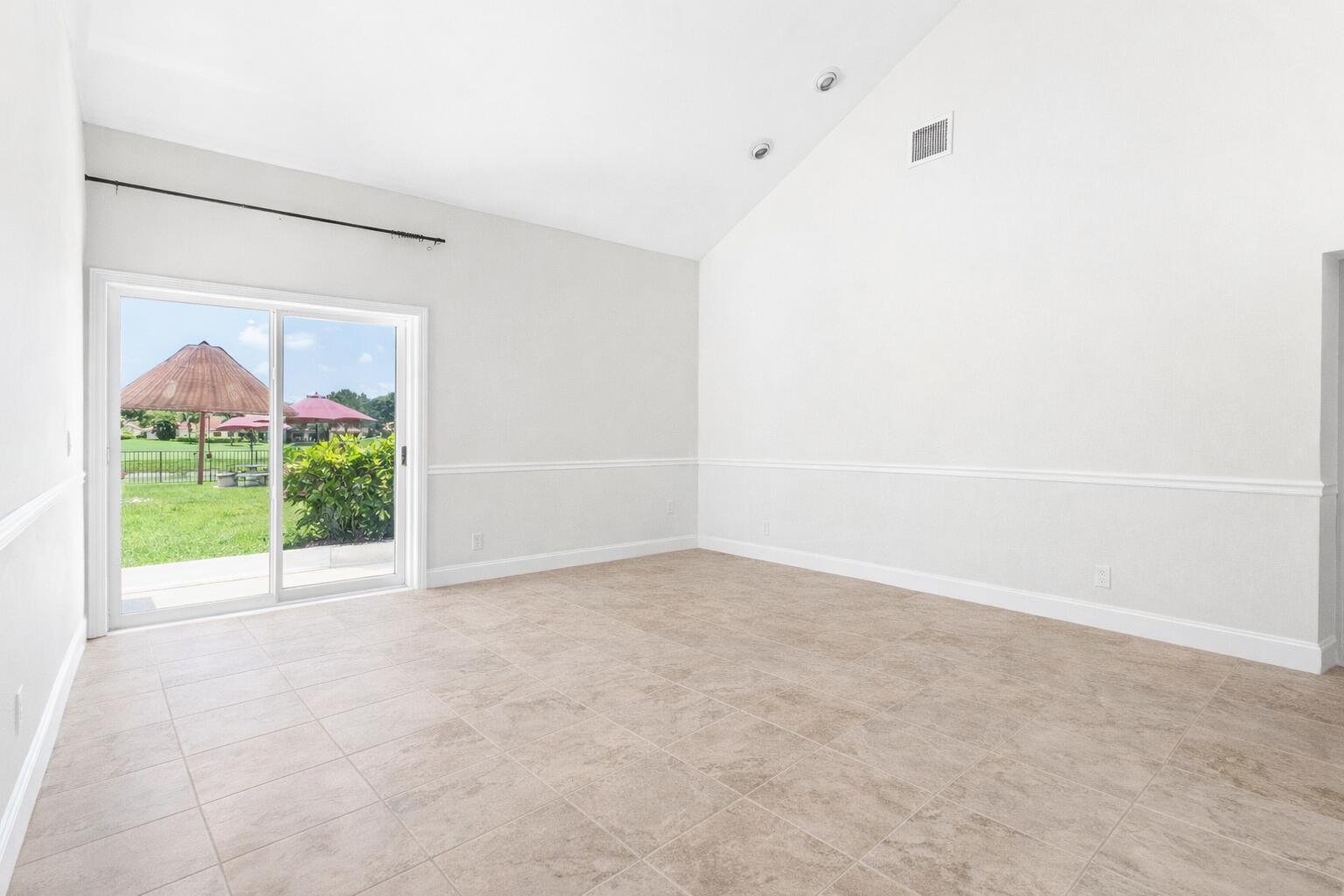 5986 Vista Linda Lane Boca Raton, FL 33433 - Photo 7 of 31 a view of an empty room with a window
