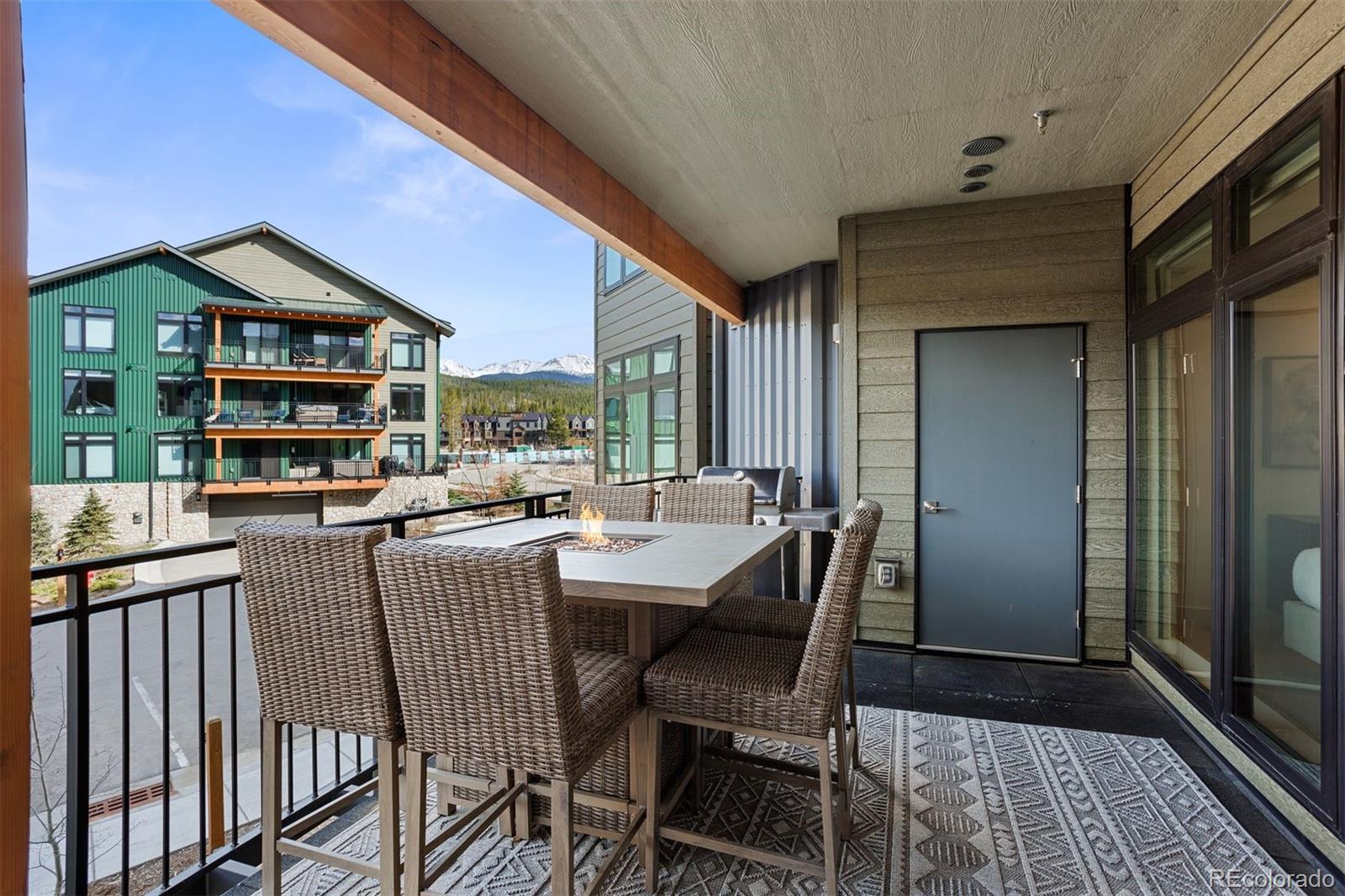 144 Ski Idlewild Road, Unit 3201 Winter Park, CO 80482 - Photo 11 of 39 a view of a patio with table and chairs