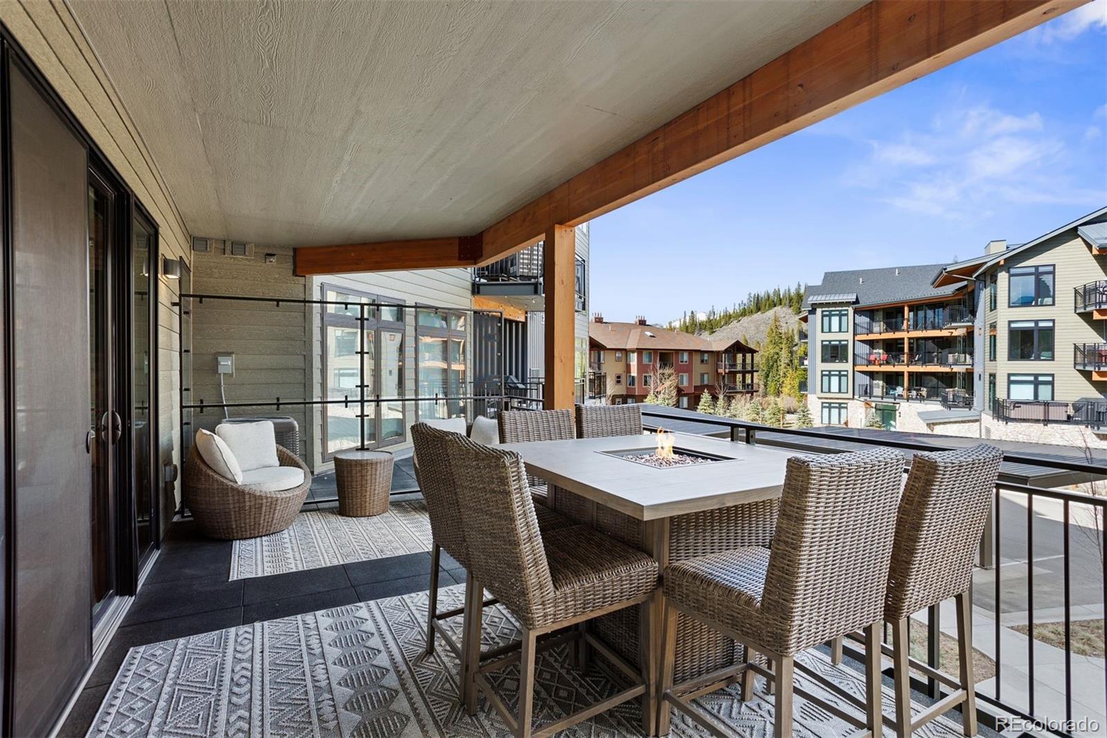 144 Ski Idlewild Road, Unit 3201 Winter Park, CO 80482 - Photo 13 of 39 a dining room with furniture and a floor to ceiling window