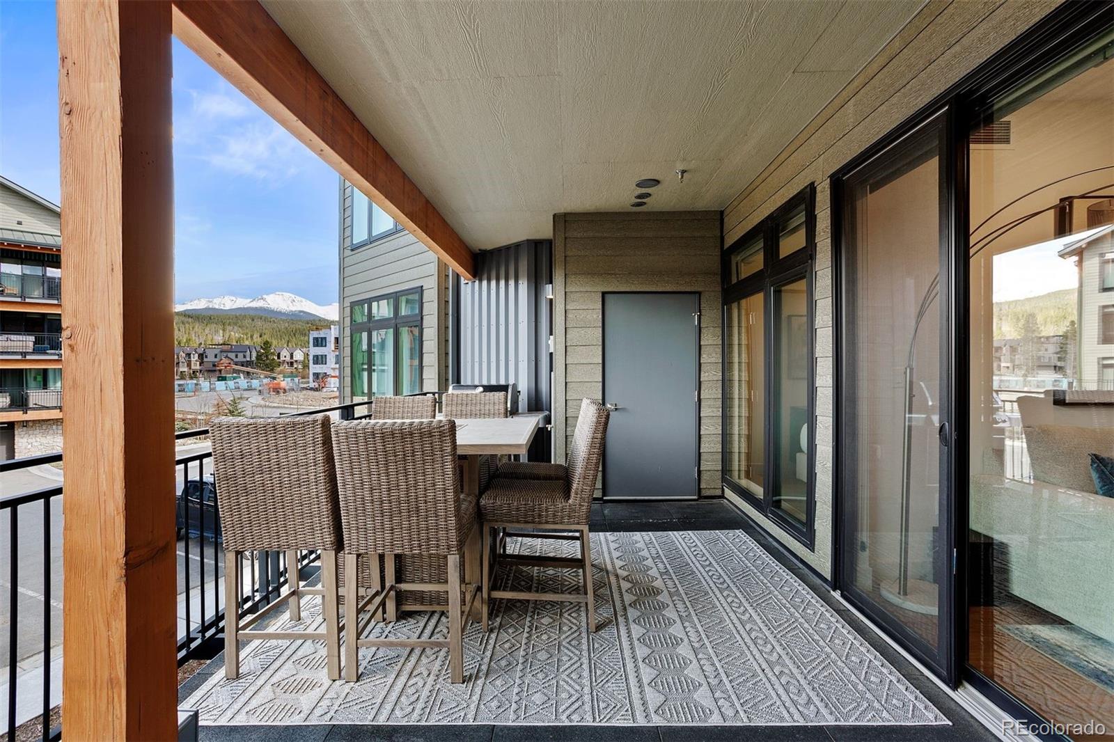 144 Ski Idlewild Road, Unit 3201 Winter Park, CO 80482 - Photo 14 of 39 a view of a dining room with furniture and wooden floor
