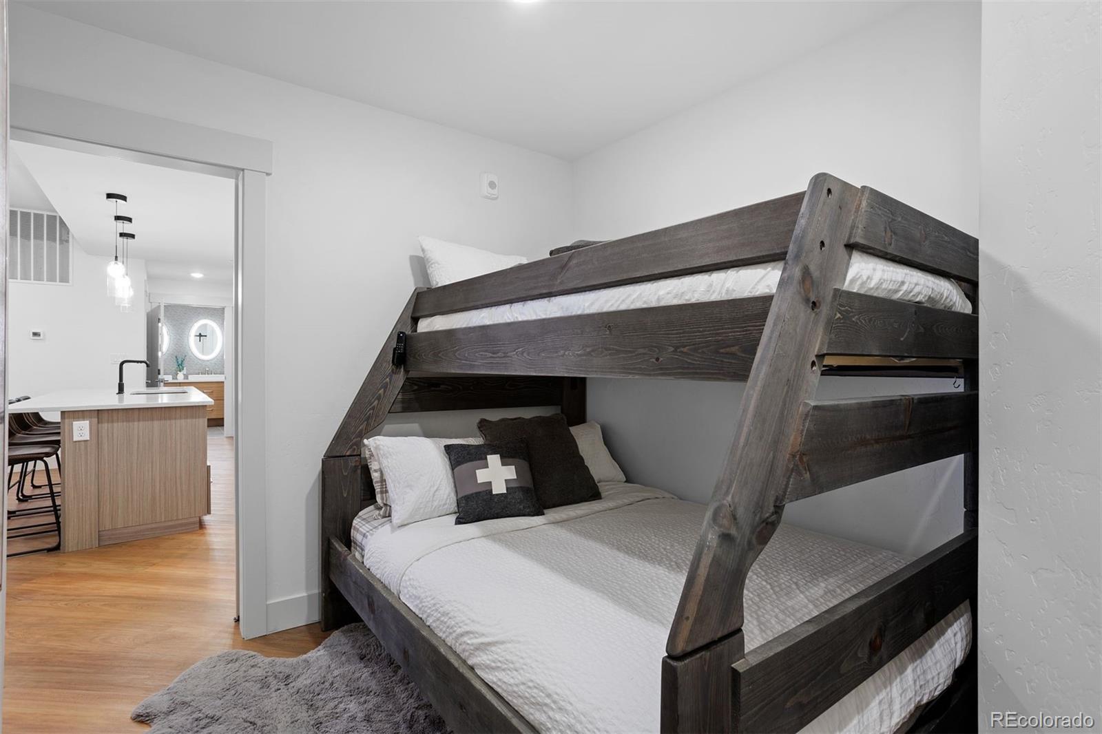 144 Ski Idlewild Road, Unit 3201 Winter Park, CO 80482 - Photo 25 of 39 a bedroom with a bed and a dresser