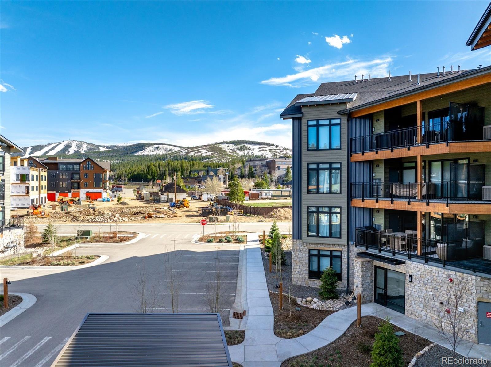 144 Ski Idlewild Road, Unit 3201 Winter Park, CO 80482 - Photo 36 of 39 a view of a patio with dining table and chairs