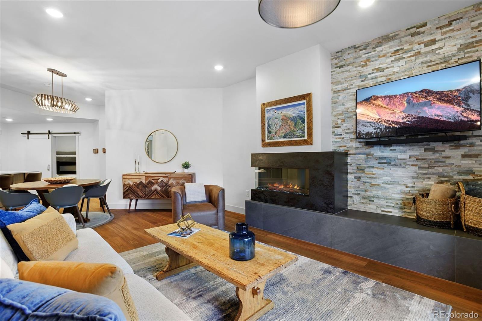 144 Ski Idlewild Road, Unit 3201 Winter Park, CO 80482 - Photo 9 of 39 a living room with furniture and a fireplace