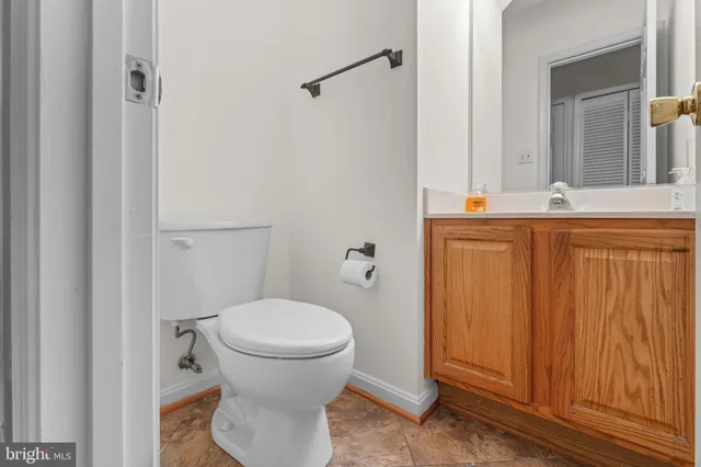 a bathroom with a toilet and a sink