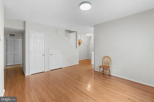 a view of a livingroom with wooden furniture