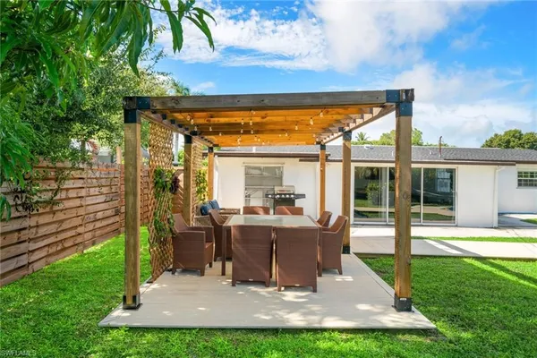 a view of a house with backyard porch and patio
