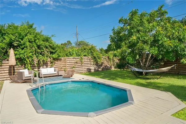 a view of a swimming pool with a patio