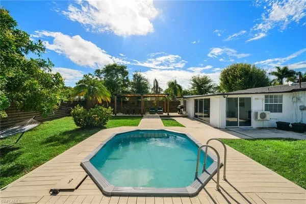 a view of a swimming pool with a patio