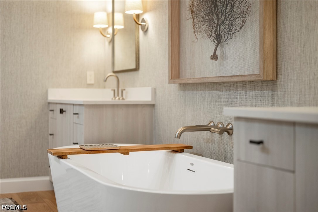 1115 Central Avenue, Unit 443 Naples, FL 34102 - Photo 27 of 40 a bathroom with a bathtub