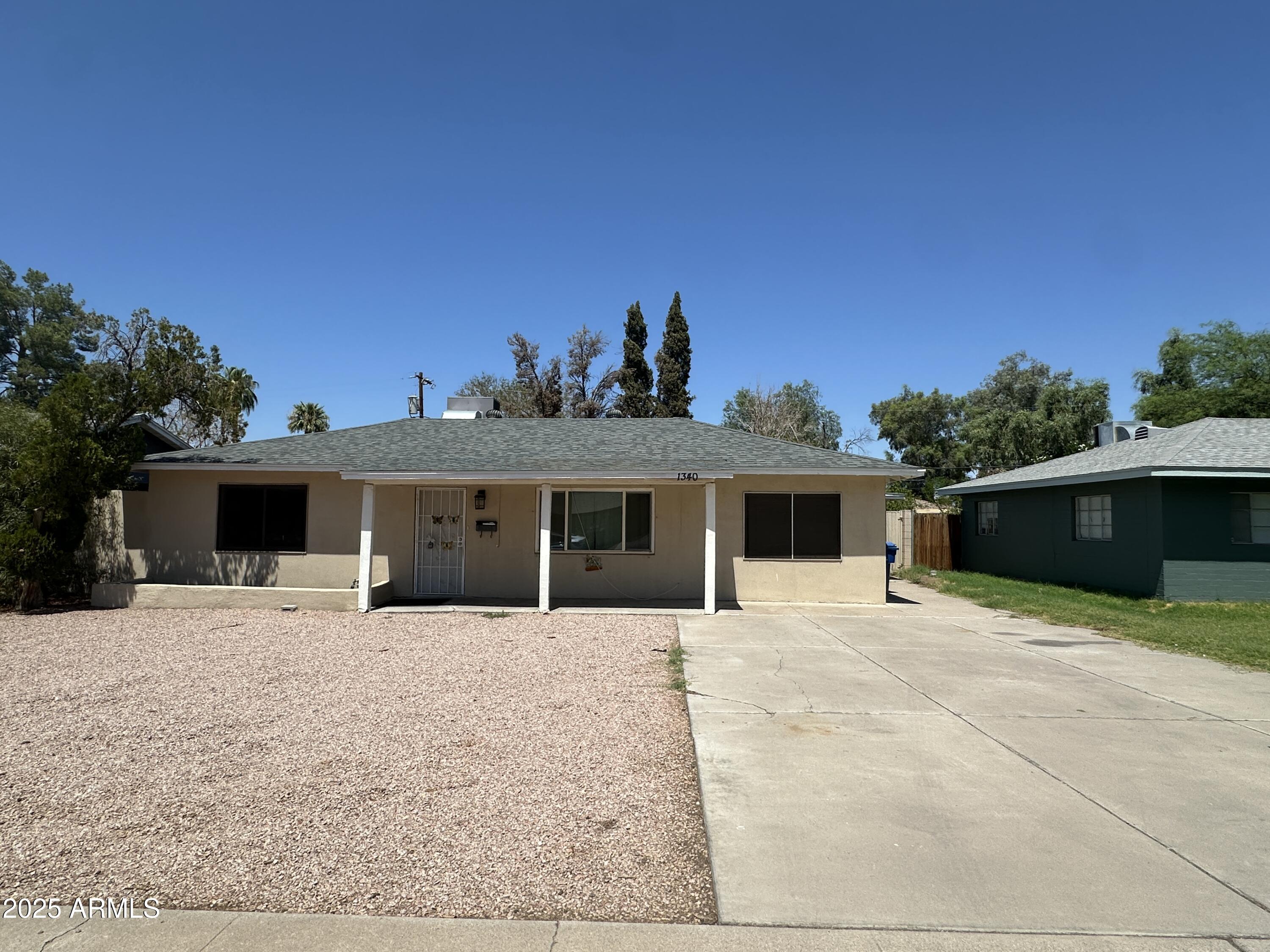1340 East Hall Street Tempe, AZ 85281 - Photo 1 of 21 a house with trees in the background
