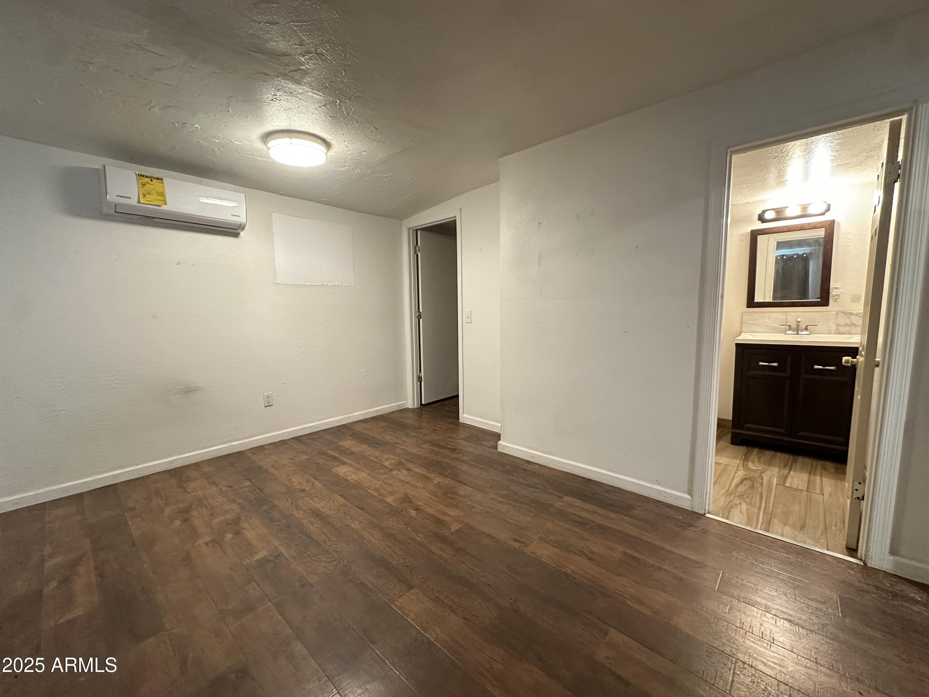 1340 East Hall Street Tempe, AZ 85281 - Photo 12 of 21 a view of a hallway with wooden floor and a kitchen