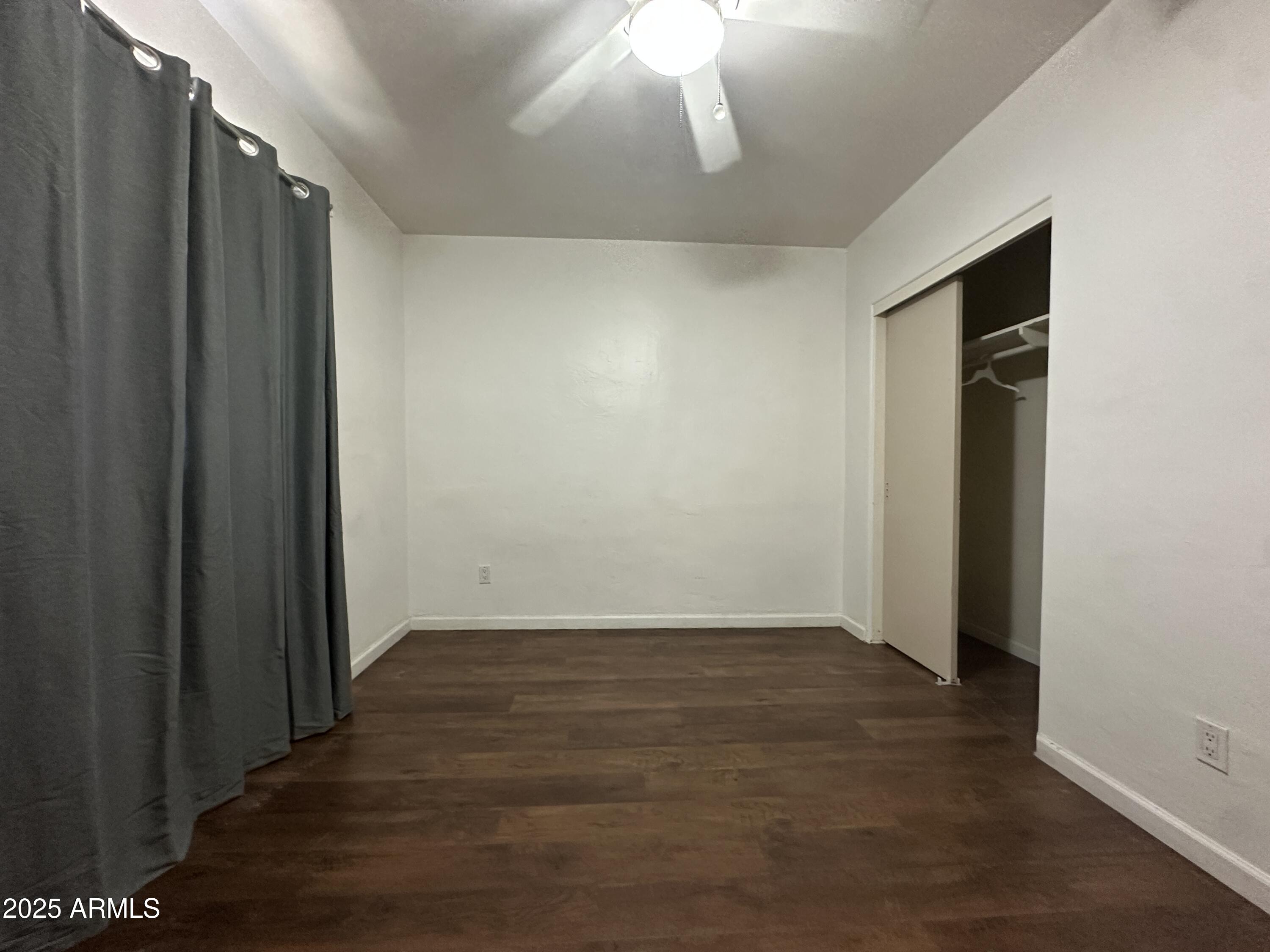 1340 East Hall Street Tempe, AZ 85281 - Photo 19 of 21 a view of an empty room with wooden floor