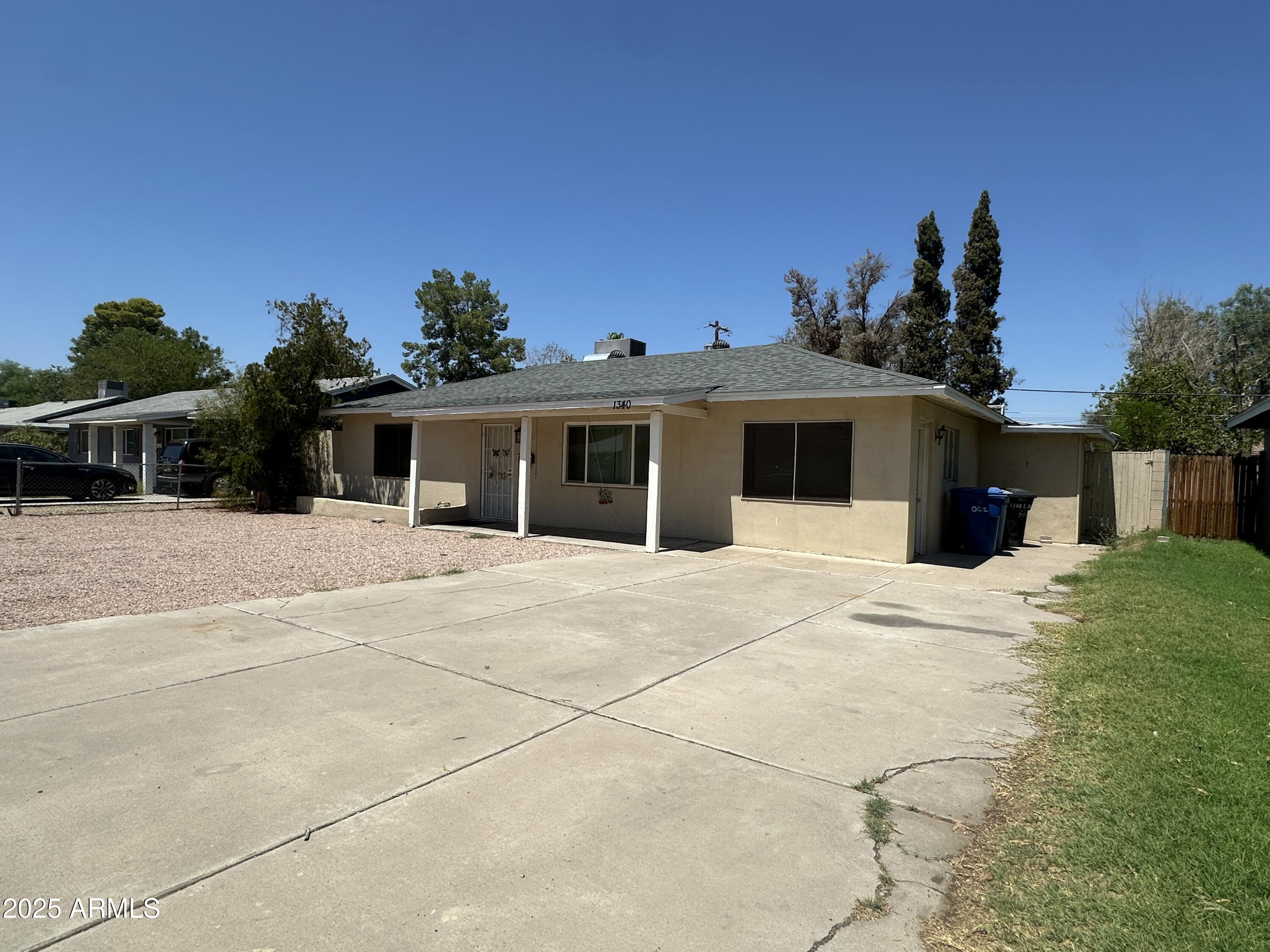 1340 East Hall Street Tempe, AZ 85281 - Photo 2 of 21 a front view of a house with a yard