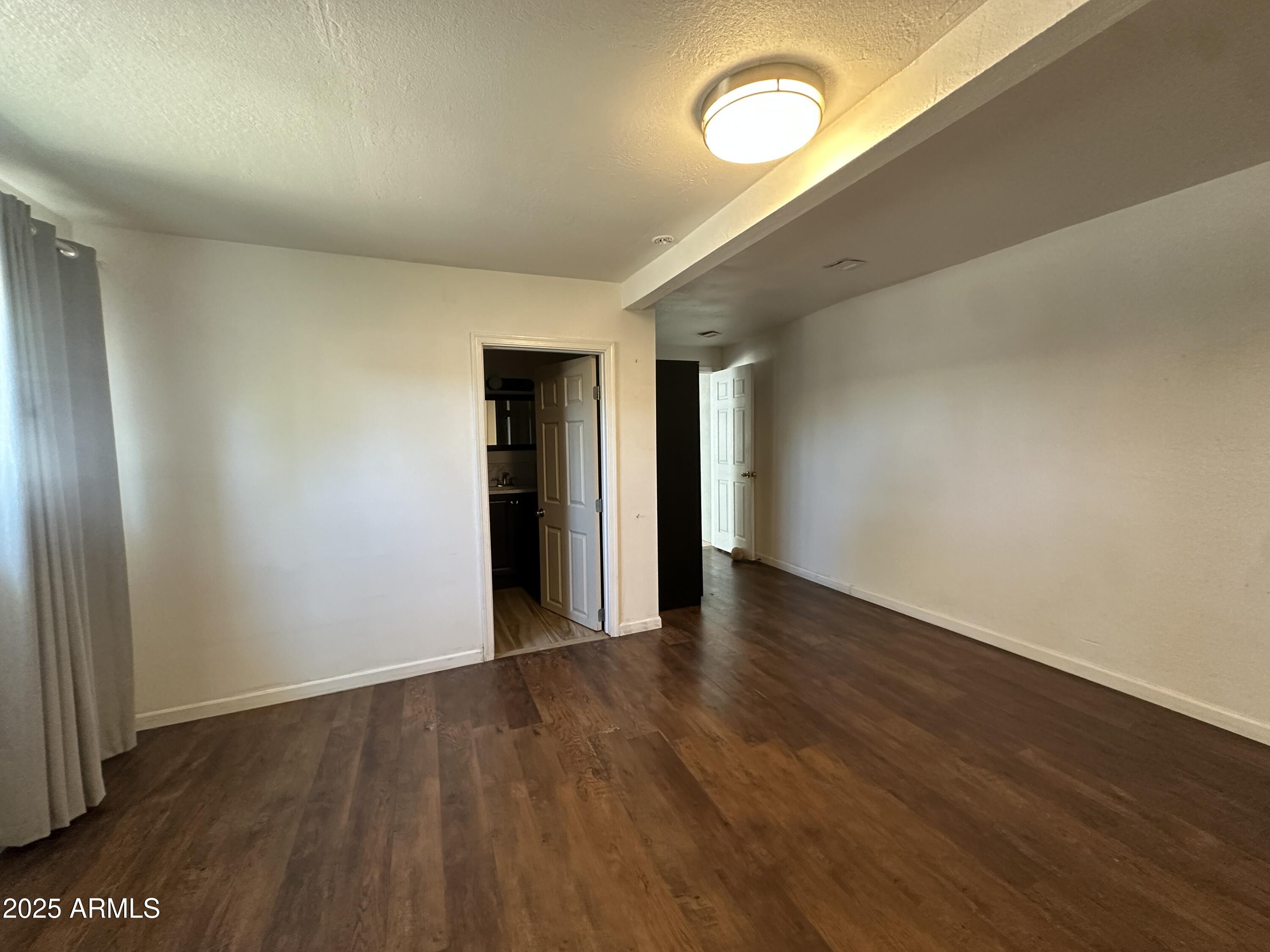 1340 East Hall Street Tempe, AZ 85281 - Photo 8 of 21 a view of an empty room with wooden floor